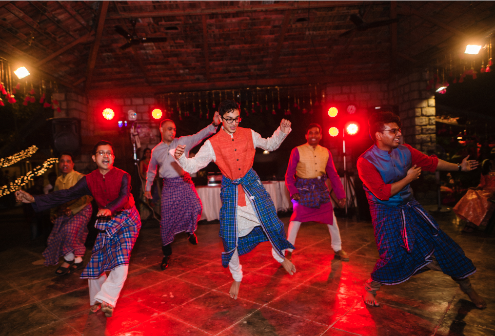 men dancing in Indian wedding